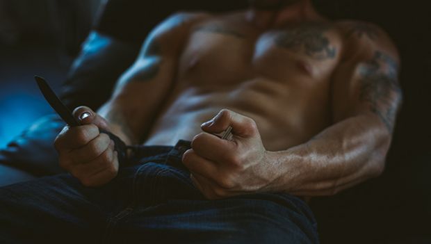Topless male with strong arms