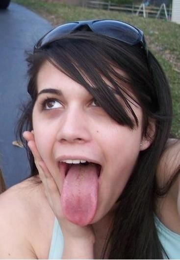 Long-tongued brunette waiting for cock