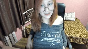 Cute nerd chick flashes her surprising football shaped hangers.