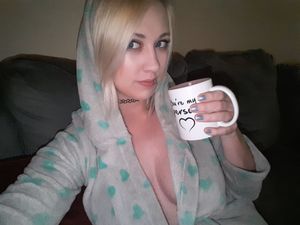 Chaturbate camgirl guiltygamer drinking coffee in hoodie showing cleavage