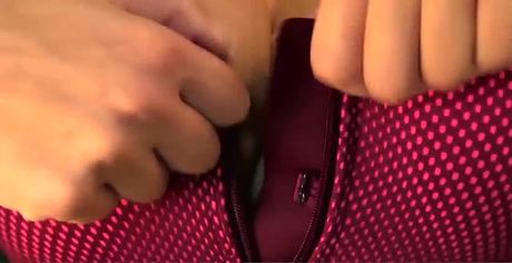 Fitting her pink sport bra!