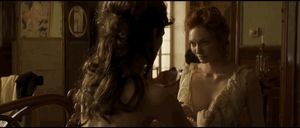 Keira Knightley undoing curious Victorian era woman’s dress
