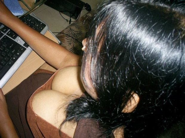 Computer babe with impressive downblouse cleavage
