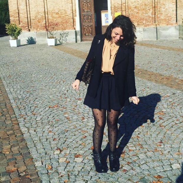 Sexy brunette in pantyhose and skirt