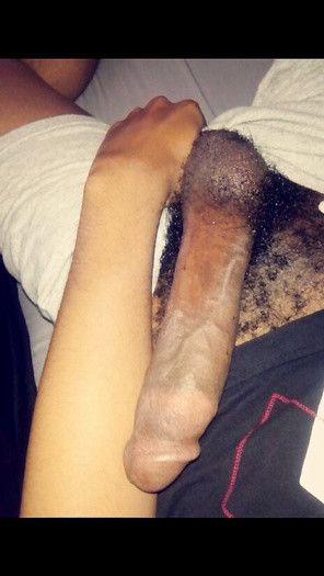 Comparing his arm to his cock