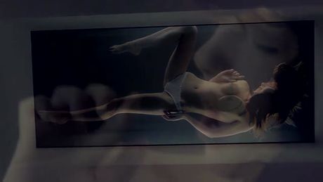 BEAUTIFUL BRUNETTE MASTUBATING ON A GLASS TABLE