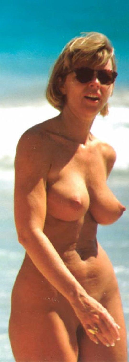 Busty MILF On The Beach