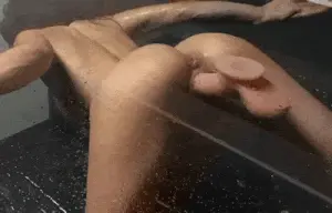 Fucking her toy against the wall