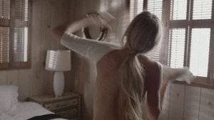 Pulling on her top for the night out....Bex was excited to see her friends tonight