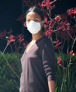 Zoe Saldana braless boobs in a sweater showing off her hard nipples pokies seen by paparazzi out in LA.