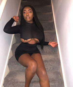 Ebony whore shows her massive tits