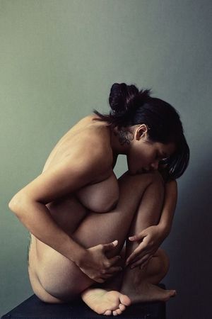 Huddled into herself