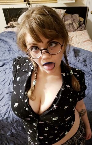 Nerdy gal sticking out her tongue