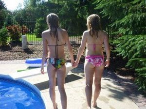 Bikini teens holding hands