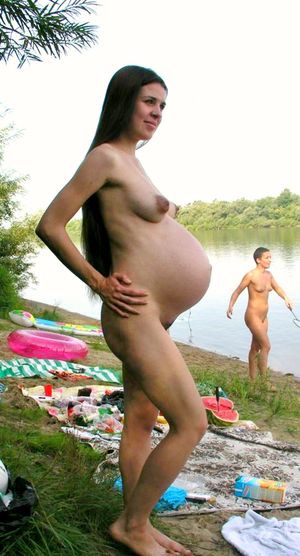 very sexy pregnant babe with beautiful body naked on the beach