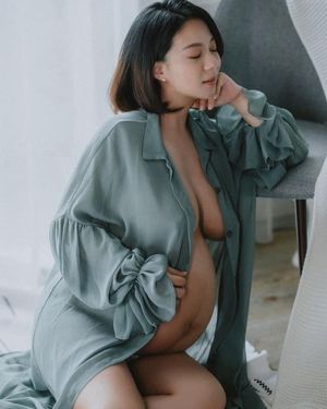 Pregnant In Blue Robe
