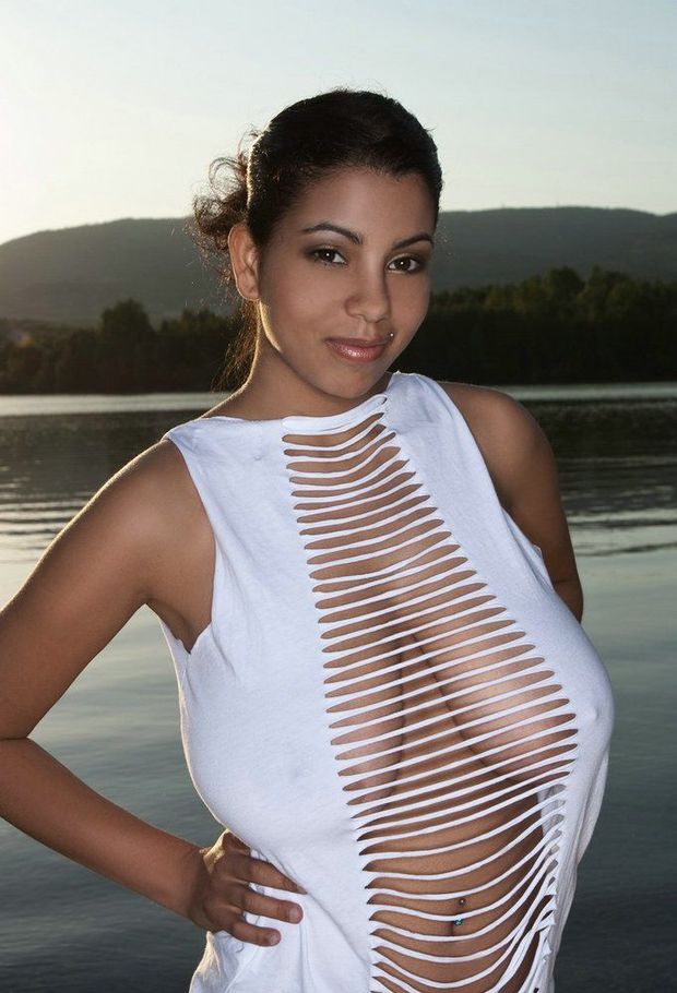 Insane pair of massive gorgeous hangers barely concealed in a shredded blouse. What a great look.