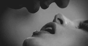 Couple Kissing In Bed