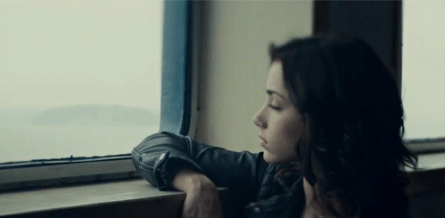 Emily Rudd Looking Out of a Train