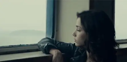 Emily Rudd Looking Out of a Train