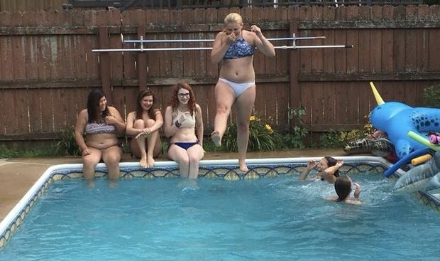 Teen jumping in the pool