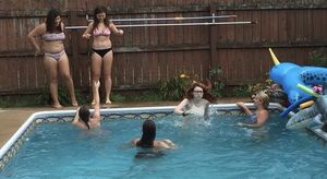 Teens partying in the pool