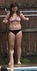 Teen standing on the side of the pool