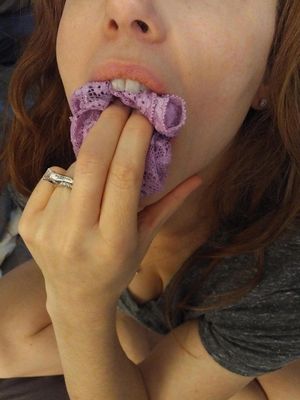 Brunette inserts panty gag