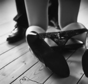 Kneeling in front of her Dom