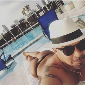 Sexy man with tan ass in thong