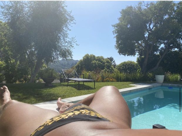 Sexy gay bulge tanning in thong bikini