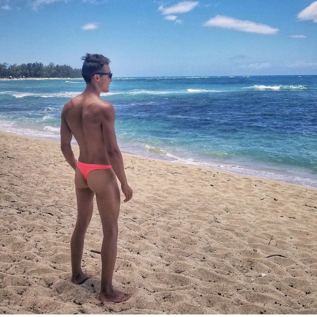 Gay guy at beach in thong