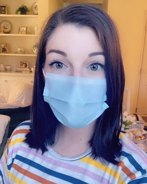 Sexy brunette wearing a mask