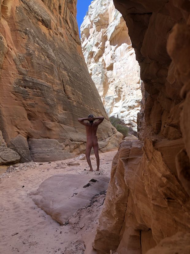 nude male hiking in desert slot canyon