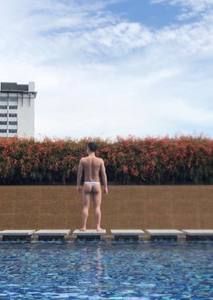 Guy wearing a thong by the pool