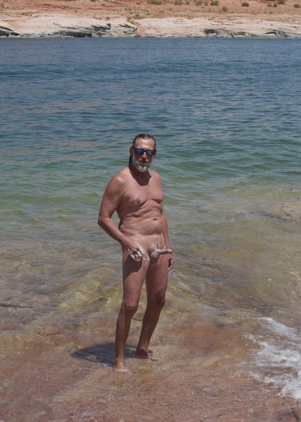nude male at lake soaping up hard on