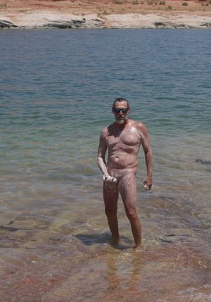 nude male soaping up boner at the lake