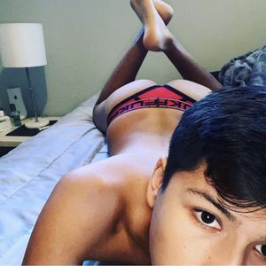 Hot twink in bed wearing thong