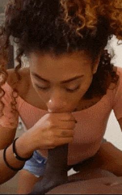 Sucking on a huge black dick