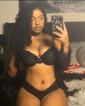 Corie Rayvon in her black bra and panties.