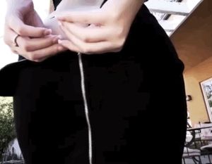 Unzipping skirt revealing her perfect ass