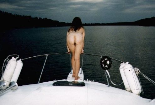 pale latvian amateur standing on boat showing ass