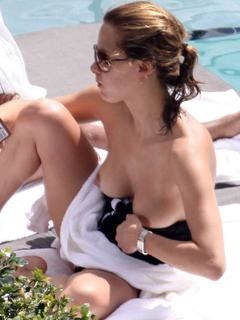Melissa Theuriau topless on a beach
