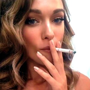 Very beautiful bitch taking a deep drag