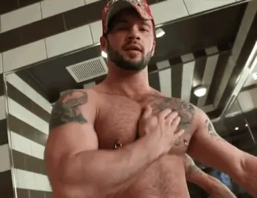 Manuel DeBoxer massages his pecs
