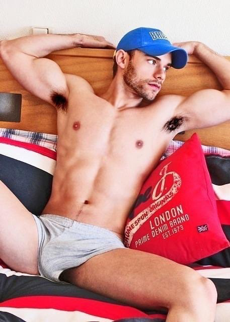 College guy poses in baseball hat