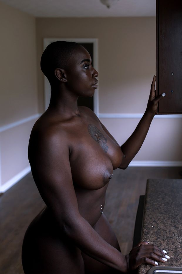 Big black woman with piercings.