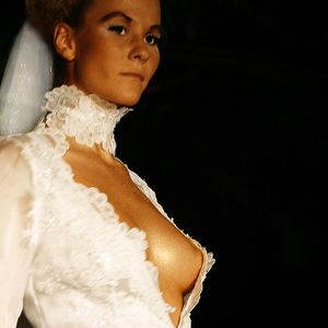 Wedding dress shows off boobs nicely.