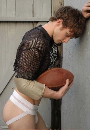 Football player in jock strap