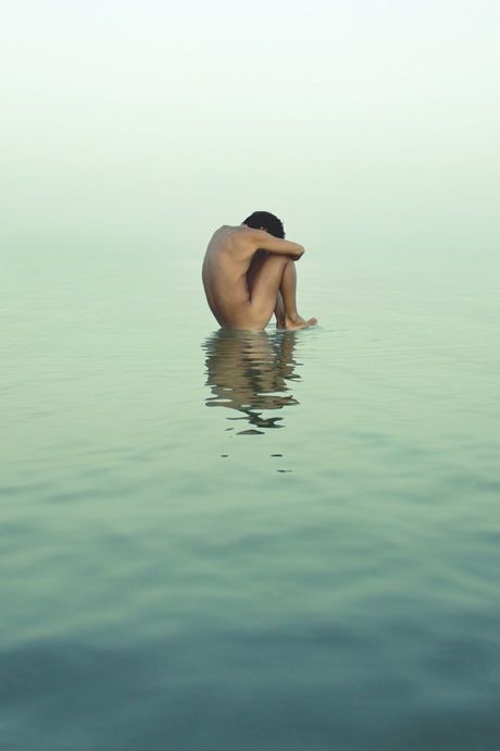 A sculpture floating on the water sea.